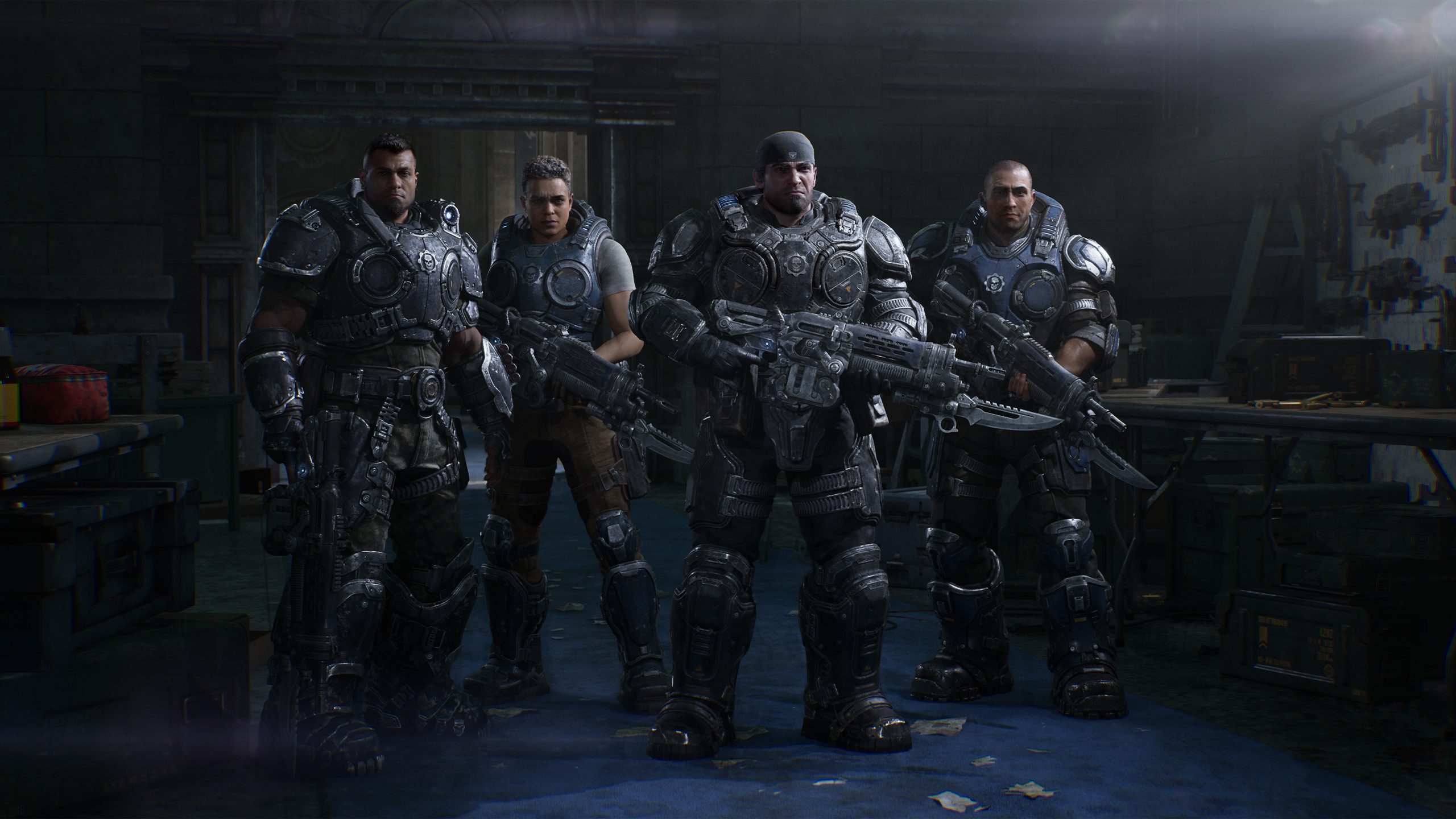 Four Gears of Bravo Squad stand ready in an armory, armor and Lancer rifles at hand.